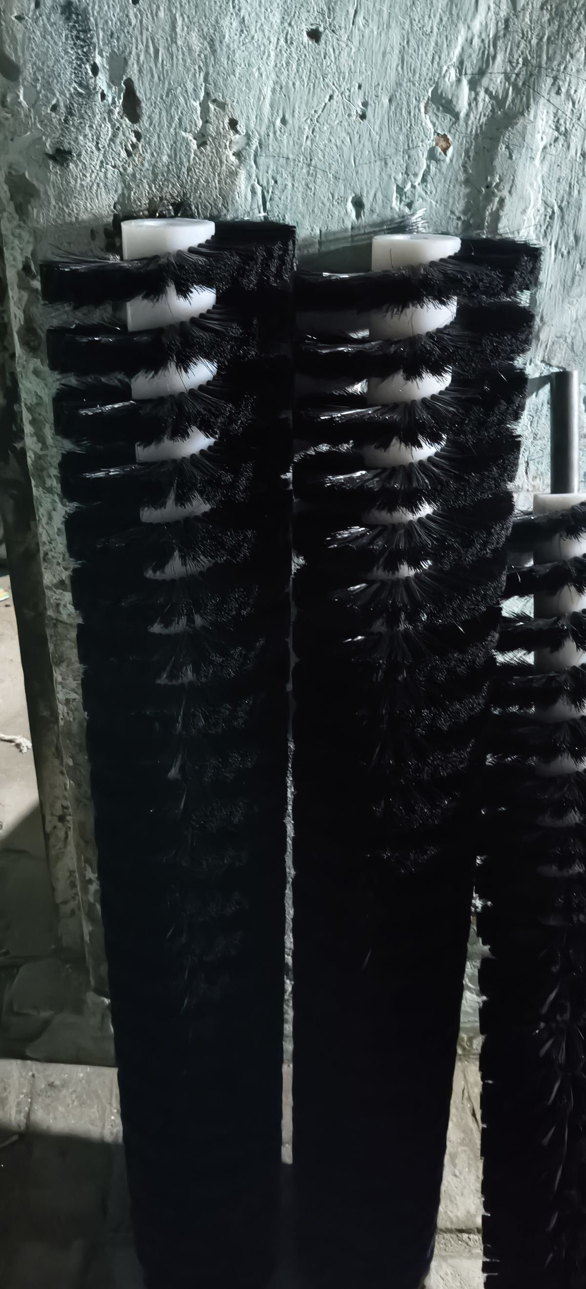 Black spiral strip brush rollers standing in the works